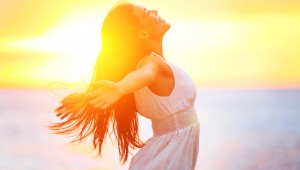Enjoyment - free happy woman enjoying sunset