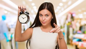 dailyweighin-Young-Woman-Holding-Clock-And-41990395